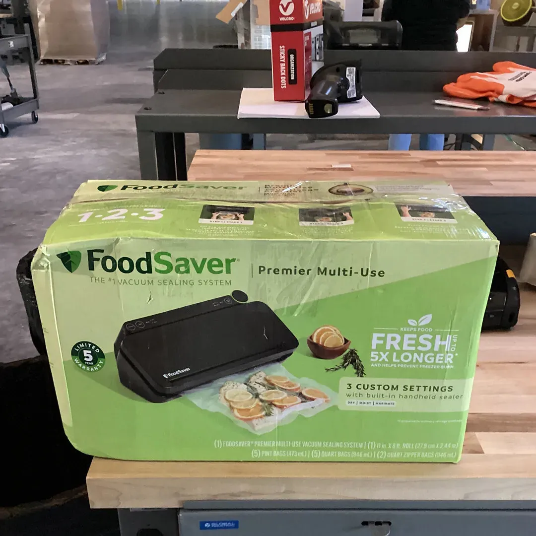 FoodSaver Premier Vacuum Sealer with Dry/Moist/Marinate Modes, Roll Storage and Cutter Bar, and Bags and Roll Starter Kit - Black